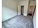 An empty bedroom filled with natural light featuring plush carpeting and a closet at 707 Pisces Ln, Summerville, SC 29486