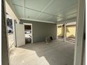 Covered porch features a painted ceiling, gray siding, and white trim details at 717 Blueway Ave, Summerville, SC 29486