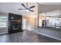 Open living space with modern fireplace and contemporary lighting adjoining the kitchen at 780 Corral Dr, Charleston, SC 29414