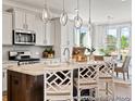 Modern kitchen with granite countertops, stainless steel appliances, and stylish pendant lighting at 1018 House Finch Ave # Cc3-22-8, Ravenel, SC 29470