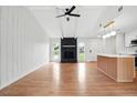 Spacious living room with vaulted ceiling, vinyl floors, fireplace, and ample natural light at 106 Ruffin Rd, Summerville, SC 29486