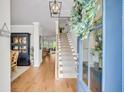 Welcoming foyer with hardwood floors, staircase, and a glimpse into the dining and living areas at 119 Loon Dr, Summerville, SC 29483