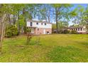 Lush back yard with mature trees and lots of room to enjoy outdoor living at 1215 Redeemer Dr, Hanahan, SC 29410