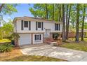 Inviting two-story home features an attached garage and brick accents on a large lot at 1215 Redeemer Dr, Hanahan, SC 29410