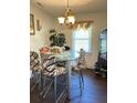 Bright dining area with a modern glass table and stylish upholstered chairs at 122 Gator Dr, Goose Creek, SC 29445