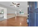 Spacious living room featuring hardwood floors, multiple ceiling fans, and an open floorplan at 1318 Foster St, Charleston, SC 29407