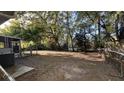 Spacious backyard with mature trees, offering ample room for outdoor activities and relaxation at 1328 White Dr, Charleston, SC 29407