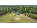 Aerial view of the property highlighting the expansive 1.46-acre lot with the main house and detached garage at 1694 Jedburg Rd, Summerville, SC 29486