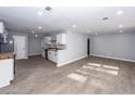 Modern kitchen featuring sleek white cabinets, butcher block countertops, and stainless steel appliances at 20 Stratton Dr, Charleston, SC 29420