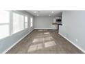 Bright and airy living room featuring large windows and modern wood-look flooring at 20 Stratton Dr, Charleston, SC 29420