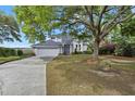Beautiful home with mature trees, green lawn, and ample parking space in a desirable neighborhood at 2345 Waring Hall Ln, Charleston, SC 29414