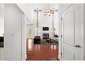 Bright living room with high ceilings, fireplace, and hardwood floors at 243 Longford Dr, Summerville, SC 29483