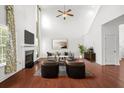 Spacious living room with fireplace, hardwood floors, and abundant natural light at 243 Longford Dr, Summerville, SC 29483