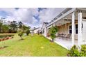 A view of the backyard with a lawn and patio at 3069 Memorial Dr, Charleston, SC 29414