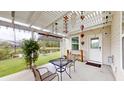 View of the patio with a table and chairs, as well as a view of the pond at 3069 Memorial Dr, Charleston, SC 29414