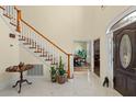 Grand foyer boasts marble floors, a curved staircase with wood trim, and a view into the formal dining room at 4029 Gift Blvd, Johns Island, SC 29455