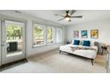 Inviting bedroom featuring ample natural light, neutral tones, ceiling fan and comfortable bed with stylish accents at 4060 S Rhett Ave, North Charleston, SC 29405