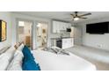 Comfortable bedroom featuring an ensuite bathroom, modern finishes, kitchenette, and stylish décor at 4060 S Rhett Ave, North Charleston, SC 29405