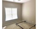 Neutral bedroom with a large window, and carpeted floors ready for personalization at 5182 Forest Oaks Dr, Hollywood, SC 29449