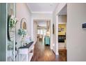 Warm and inviting entryway featuring hardwood floors and stylish decor at 5560 Alpine Dr, Summerville, SC 29483