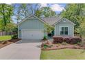 Well maintained single story home with attached two car garage and mature landscaping at 5560 Alpine Dr, Summerville, SC 29483