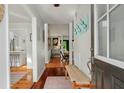 Hallway featuring beautiful hardwood floors and inviting transition to the rest of the home at 597 Oyster Rake Dr, Kiawah Island, SC 29455
