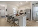 Bright kitchen features stainless steel appliances and a granite countertop island with seating at Tbd O'Leary Circle, Summerville, SC 29483