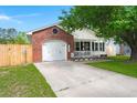 Inviting single-Gathering home with a well-maintained lawn, brick accents, and a garage, perfect for comfortable living at 1306 Markley Ct, Moncks Corner, SC 29461