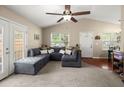Spacious living room with vaulted ceilings, large sectional sofa, and natural light from the entryway and adjacent room at 1306 Markley Ct, Moncks Corner, SC 29461