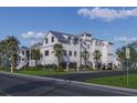 Stunning exterior view of the home highlighting the three-car garage, landscaping, and classic architectural style at 1715 Middle St, Sullivans Island, SC 29482