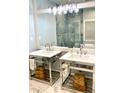 Elegant bathroom featuring double sinks with chrome fixtures, stylish vanities, decorative storage baskets, and a large mirror at 2000 Gray Battery Court Ct, Mount Pleasant, SC 29464