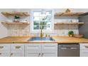 Charming kitchen featuring butcher block countertops, floating shelves, and stainless steel appliances at 201 Driver Ave, Summerville, SC 29483