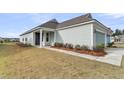 Charming one-story home with manicured lawn and walkway leading to the front door at 202 Garden Gate Way, Summerville, SC 29486