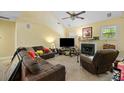 Cozy living room with a fireplace, vaulted ceilings, and multiple windows at 213 Travelers Rest Blvd, Summerville, SC 29485