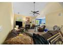 Spacious living room with natural light, a ceiling fan and a cozy fireplace at 213 Travelers Rest Blvd, Summerville, SC 29485