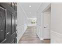 Inviting entryway with gray walls, white trim, and modern flooring leading to the main living areas at 215 Overcup Loop, Summerville, SC 29486
