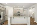 Modern kitchen featuring stainless steel appliances, granite countertops, and a spacious kitchen island at 2152 Macallan Blvd, Ravenel, SC 29470