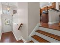 Bright entryway with hardwood floors and staircase leading to the main living area at 2519 Rutherford Way, Charleston, SC 29414