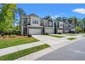 Well maintained townhomes with private driveways, two-car garages, green lawns and manicured landscaping at 3010 Emma Ln, Mount Pleasant, SC 29466