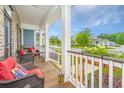 Inviting front porch with cozy seating, perfect for relaxing and enjoying the neighborhood views at 3466 Yarmouth Dr, Mount Pleasant, SC 29466