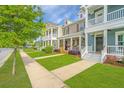 Charming two-story townhomes with inviting front porches and sidewalks for an active community at 3466 Yarmouth Dr, Mount Pleasant, SC 29466
