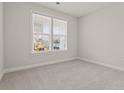 Cozy bedroom with neutral carpet and white walls, illuminated by natural light at 347 Wappoo Trace Ln, Summerville, SC 29486