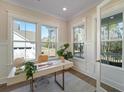 Bright home office with ample natural light, modern desk, and stylish decor at 4155 Jean Laffite Rd, Hollywood, SC 29449