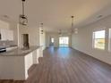 Open-concept kitchen with large island, granite counters, and stainless steel appliances at 434 Pender Woods Dr, Summerville, SC 29486