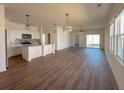 Open floor plan with modern kitchen, dining, and living area with lots of natural light at 434 Pender Woods Dr, Summerville, SC 29486