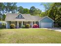 Charming single-story home featuring a well-manicured lawn and beautiful landscaping in a desirable location at 4429 Highway 162, Hollywood, SC 29449