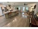 Open-concept kitchen features a large island, stainless steel appliances, and a seamless flow into the living area at 640 Semaht St, Charleston, SC 29412