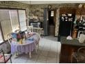 Functional kitchen space with a dining area, vintage wallpaper, and essential appliances at 805 Horne St, Saint George, SC 29477