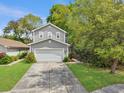 Charming two-story home with gray exterior siding and well-maintained green lawn and driveway at 8810 Gilston Ln, North Charleston, SC 29420