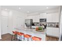 Kitchen with granite countertops, stainless steel appliances, and orange bar stools at 1040 Forrest Creek Dr, Summerville, SC 29483